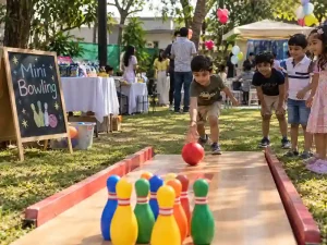 Children playing mini bowling game at a naming ceremony in Bangalore