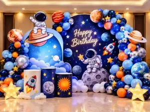 Space theme kids birthday decoration with astronaut, planets, rocket and blue balloon arch in Bangalore