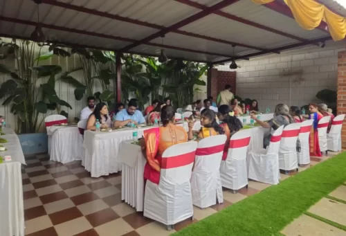 Family enjoying Andhra lunch served on banana leaves in Bangalore