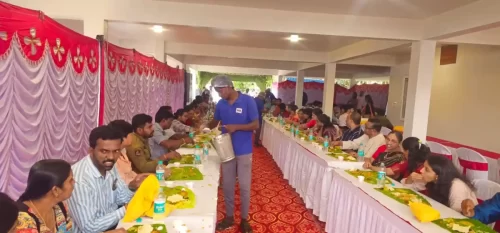 Long dining setup serving Andhra meals for a large crowd in Bangalore