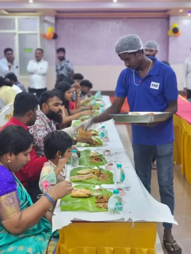 Guests enjoying Andhra-style wedding catering served on banana leaves in Bangalore