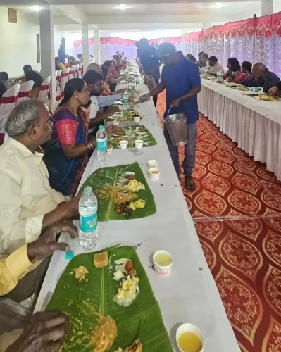 Guests enjoying festive banana leaf meal during celebration