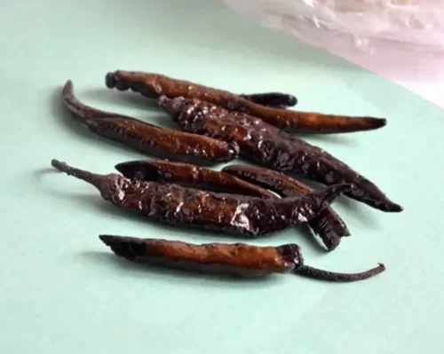 Sun-dried and fried Andhra oora mirapakaya chillies
