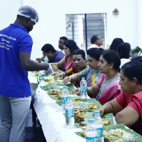 Traditional Andhra leaf service dining setup with guests enjoying meals