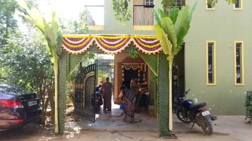 Festive chappara flower decoration with colorful garlands for housewarming