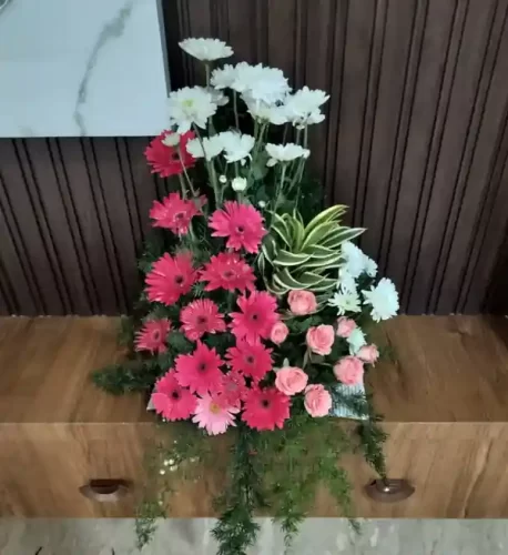 Fresh flower bouquet arrangement for gruhapravesham ceremony in Bangalore