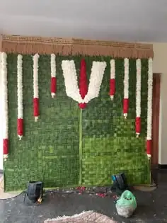 Satyanarayana puja flower decoration setup for griha pravesh ceremony