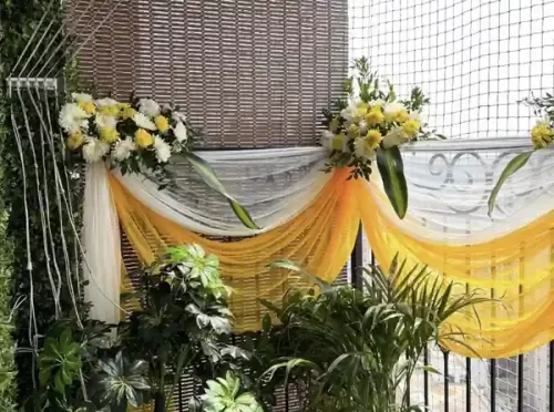 Gruhapravesha balcony flower decoration with fresh marigold garlands