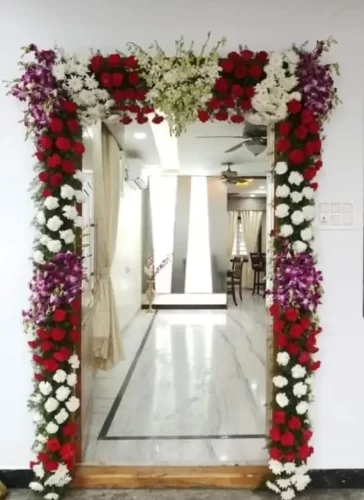 Gruhapravesha main door floral decoration with fresh flowers