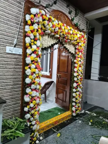 Gruhapravesha main door flower decoration ideas for housewarming