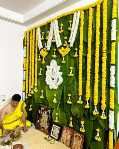 Gruhapravesha puja flower decoration with banana leaves and marigold garlands in Bangalore