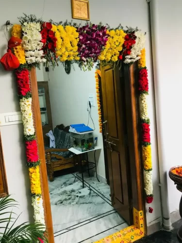 Complete flower setup for gruhapravesham main door in Bangalore