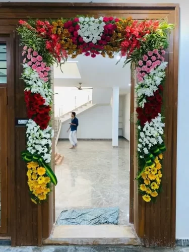 Fresh flower decoration for gruhapravesham main door entrance