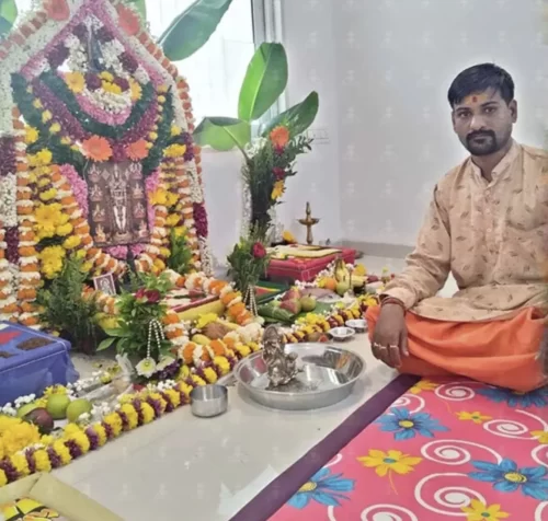 Pujari performing gruhapravesham rituals inside new home