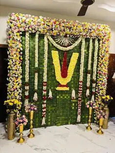 Traditional Satyanarayana puja flower decoration for gruhapravesham