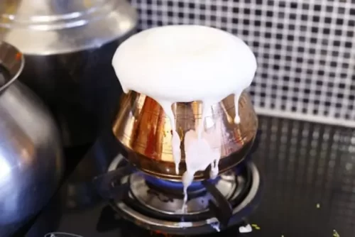 Traditional milk boiling pooja during gruhapravesham in Bangalore