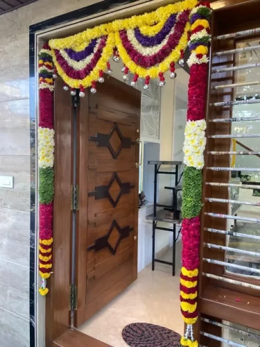 Elegant floral arrangements for house warming main door in Bangalore