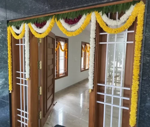Premium flower decoration for house warming main door in Bangalore
