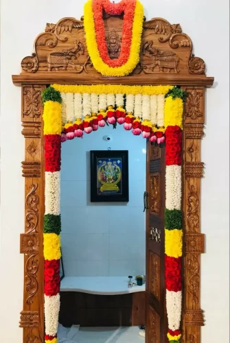 Fresh flower arrangements for housewarming pooja room decoration in Bangalore