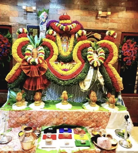 House warming puja flower decoration with traditional floral garlands and backdrop