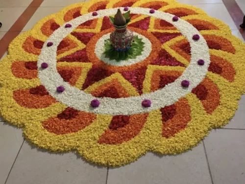 Flower rangoli decoration at housewarming entrance in Bangalore