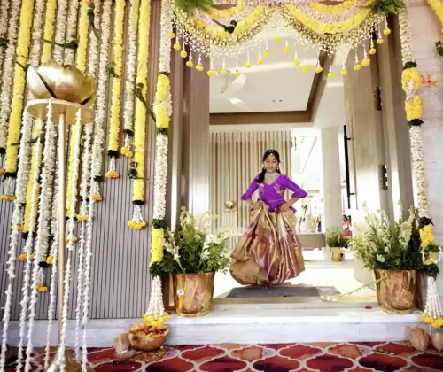 Professional housewarming event photography with guests and pooja