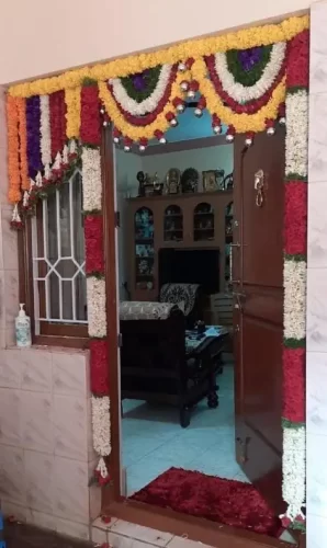 Marigold flower decoration for housewarming main door in Bangalore