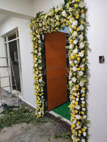 Pooja flower decoration for housewarming main door in Bangalore