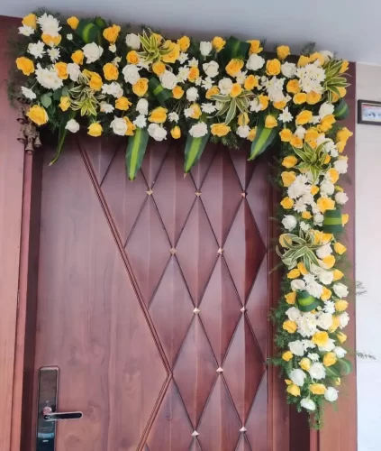 Simple flower decoration for housewarming main door in Bangalore