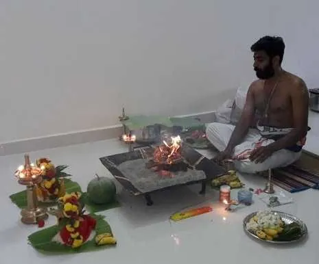 Housewarming pandit conducting pooja and homam