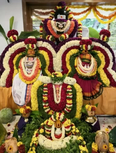 Housewarming puja flower decoration with traditional floral backdrop