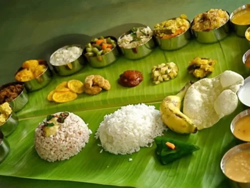 Traditional Karnataka style vegetarian meal served on banana leaf with rice, sambar, rasam, palya, kosambari and sweets