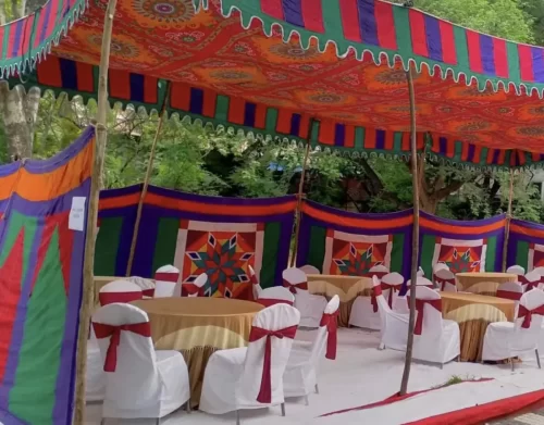 Shamiyana with round table seating for housewarming ceremony in Bangalore