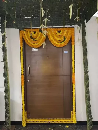 Simple chappara flower decoration for apartment housewarming ceremony in Bangalore
