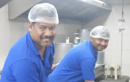 Traditional Andhra catering chefs working together in a large kitchen setup