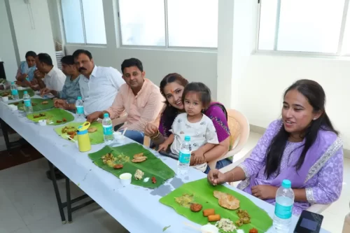 Guests enjoying traditional Andhra style leaf meal during an event in Bangalore