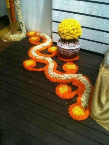 Flower rangoli with pot for house wanming ceremony Bangalore