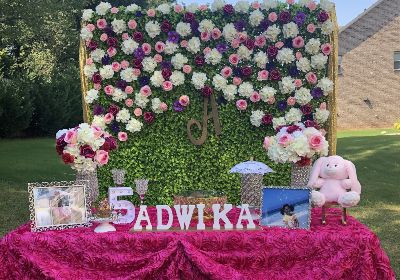 Outdoor birthday party decoration with grass backdrop Bangalore